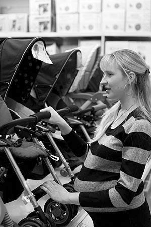 pregnant woman shopping for baby products