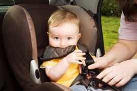 buckling baby into car seat